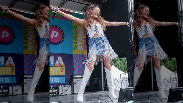 Kylie Morgan performing in denim and white combo