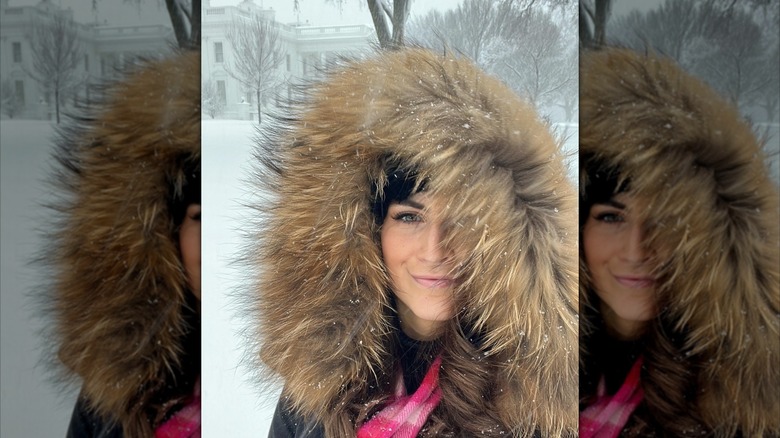 Kaitlin Collins takes a selfie by the White House in 2022