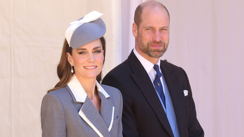 Prince William and Princess Catherine smiling and looking into the camera