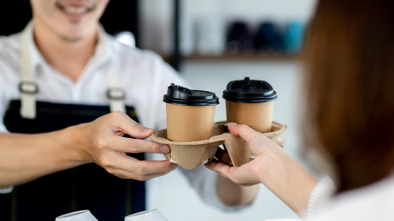 Person serving coffee