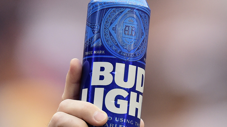 Tall skinny bud light can in hand