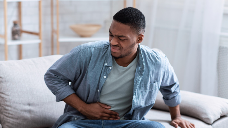 Man holding his appendix