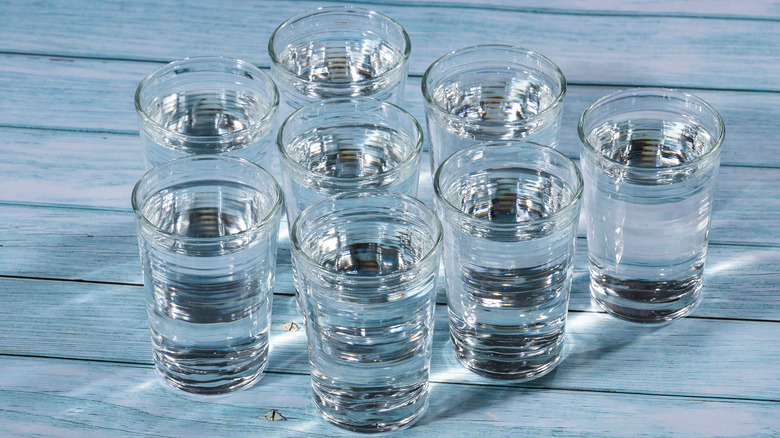 Glasses of water nuzzled together
