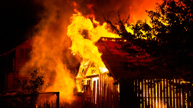 House on fire at night