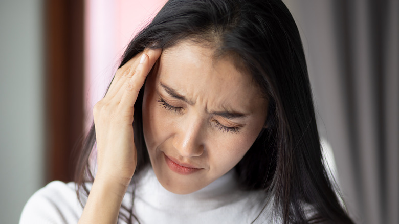 Woman suffering from vertigo