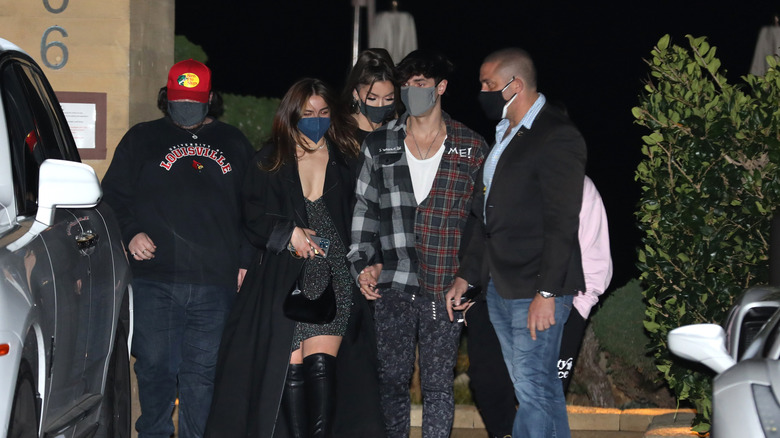 Addison Rae and Bryce Hall holding hands