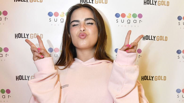 Addison Rae giving peace signs