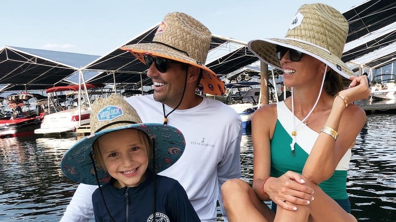 The Rancic family smiling on a boat