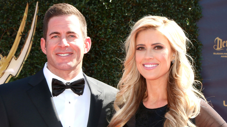 Tarek El Moussa and Christina Haack smiling at an event in black tie attire
