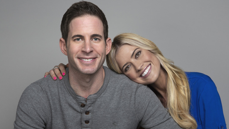 Christina Haack leaning into Tarek El Moussa smiling