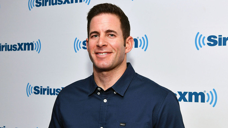 Tarek El Moussa smiling on SiriusXM step-and-repeat