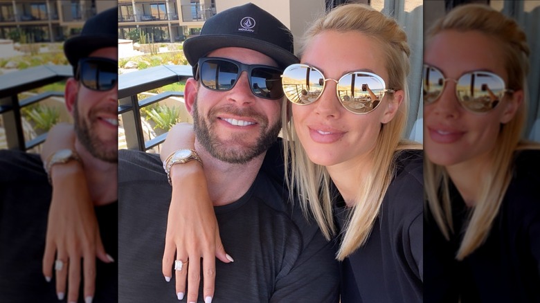 Tarek and Heather Rae El Moussa leaning into each other for a selfie