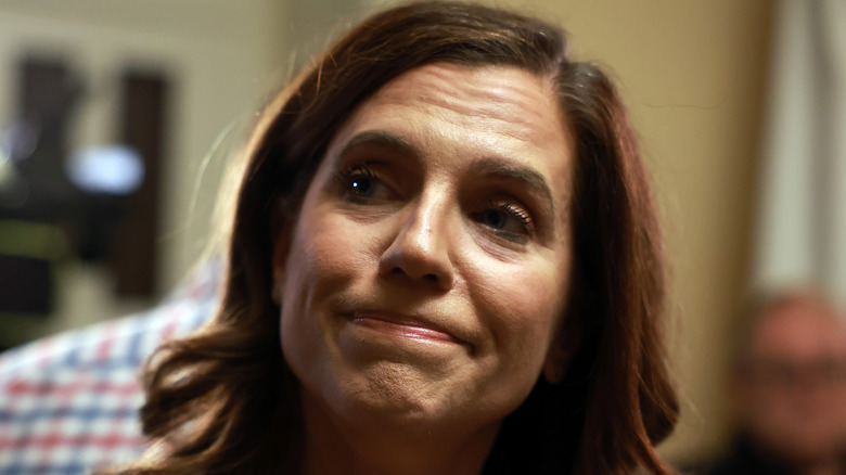 Nancy Mace pursing her lips together while speaking to reporters at the U.S. capitol.