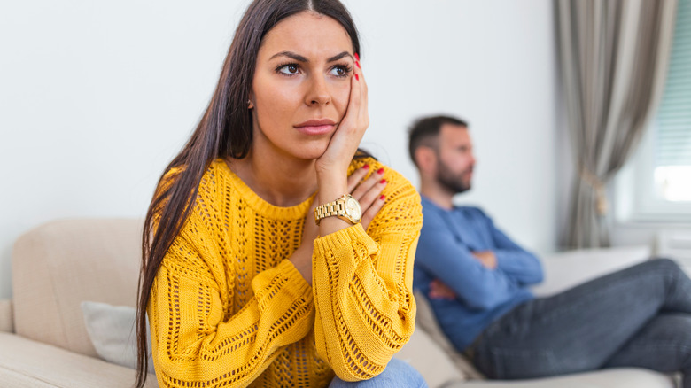 woman looking upset with her boyfriend