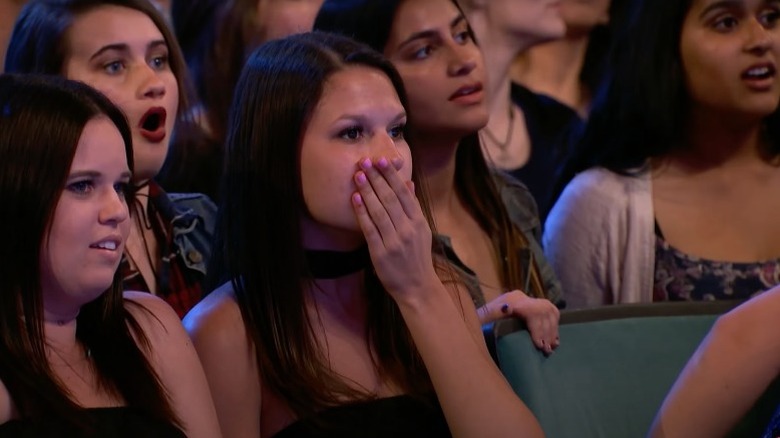 Crowd of people gasps