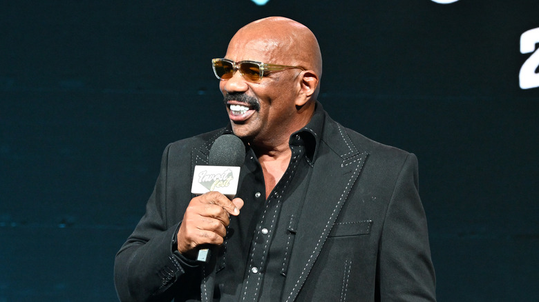 Steve Harvey smiling with microphone