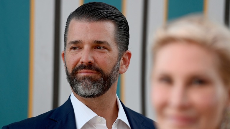 Donald Trump Jr. in front of a striped wall