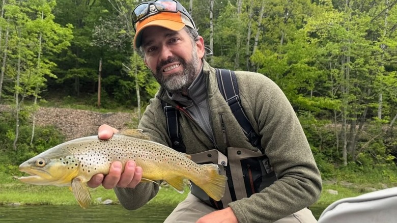 Donald Trump Jr. holds up a fish