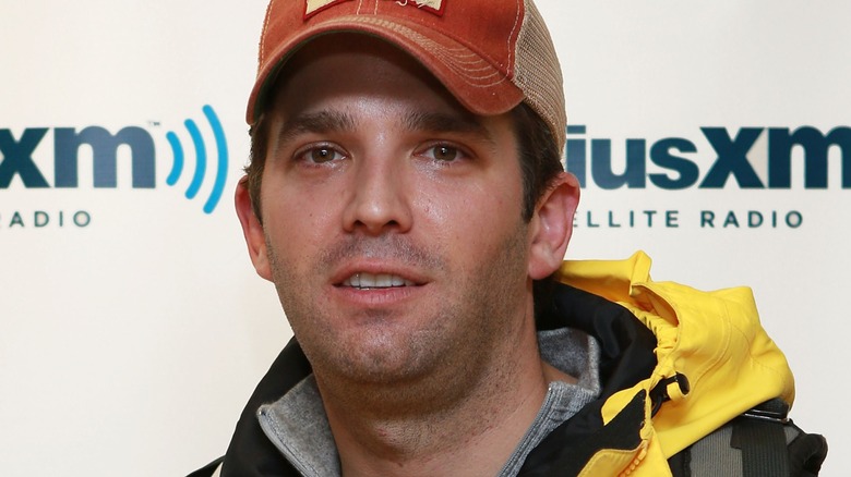 Donald Trump Jr. in front of a Sirius XM step and repeat