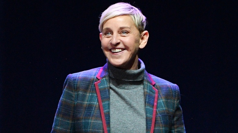 Ellen DeGeneres smiling while talking on stage