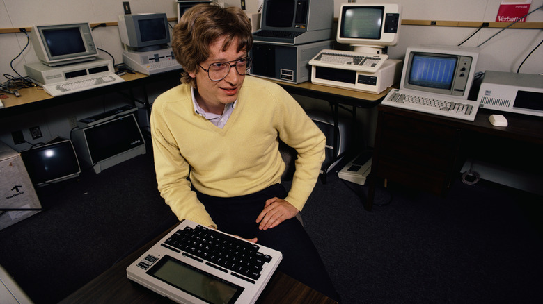 Young Bill Gates surrounded by computers