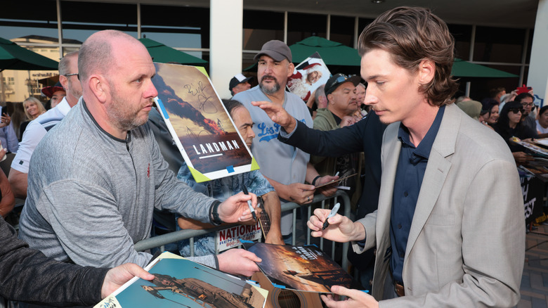 Jacob Lofland signing autographs for fans