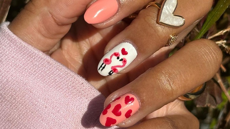 Woman with pink coral nails