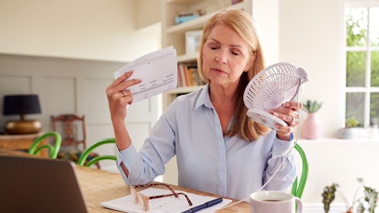 woman having hot flashes