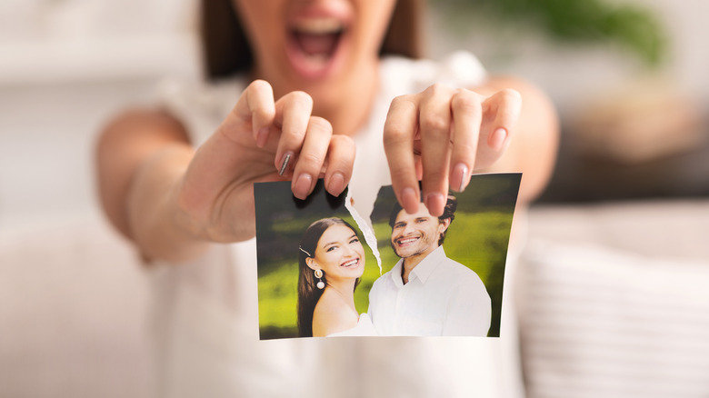 Woman rips up a picture of her and her ex