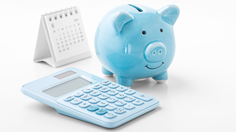 piggy bank, calculator, and calendar