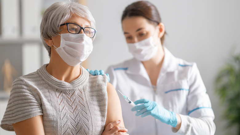 Woman getting vaccinated against COVID-19