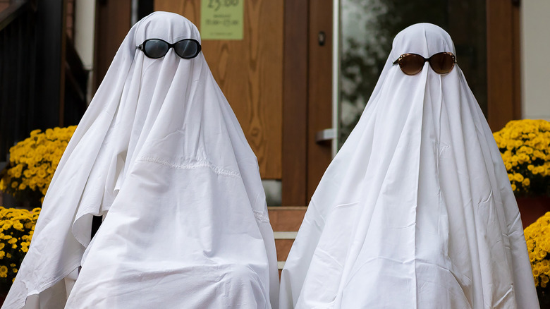 Couple dressed as ghosts