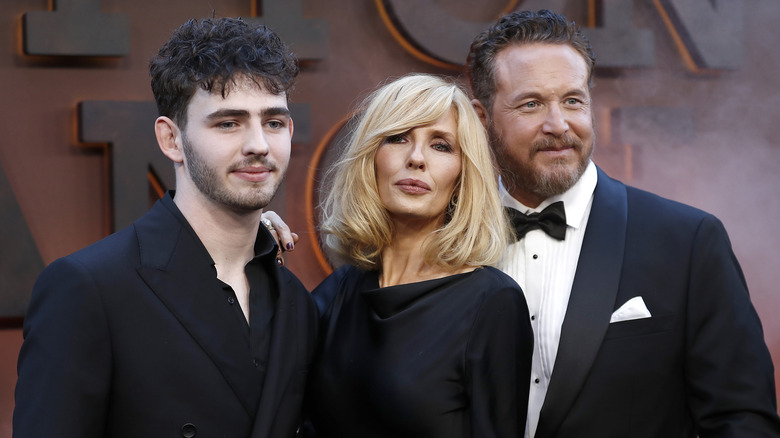 Finn Little, Kelly Reilly, and Cole Hauser posing at a red carpet event for 