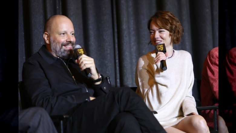 Yorgos Lanthimos and Emma Stone onstage during a "Bugonia" BAFTA screening in West Hollywood, CA (2025)