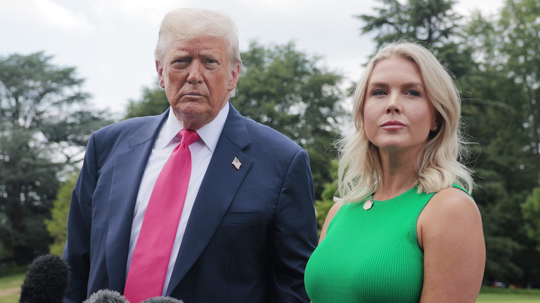Donald Trump and Caroline Leavitt looking grim