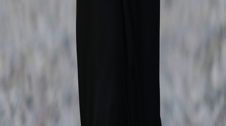 Woman wearing blue leather gloves