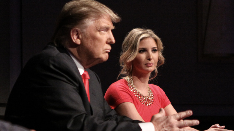 Donald and Ivanka Trump sit at table