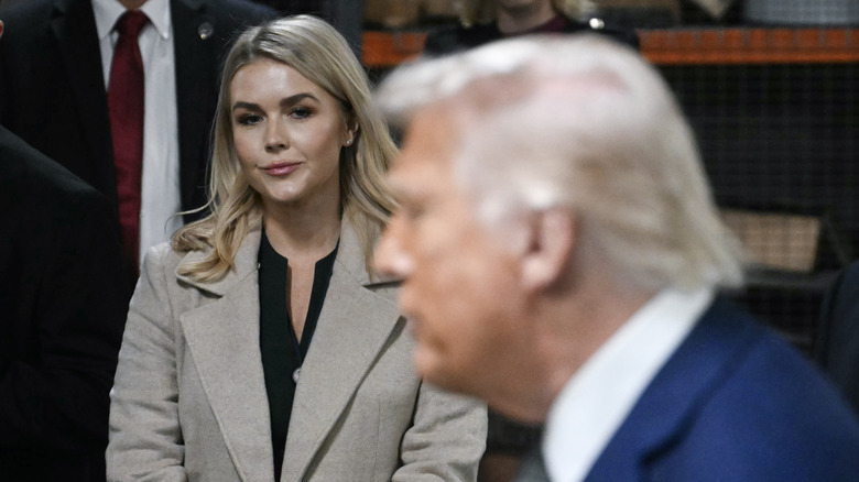 Karoline Leavitt looking at Donald Trump