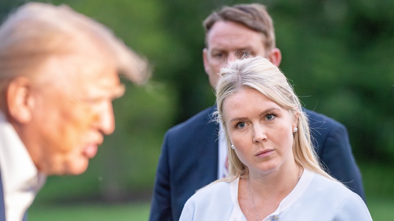 Karoline Leavitt looking at Donald Trump