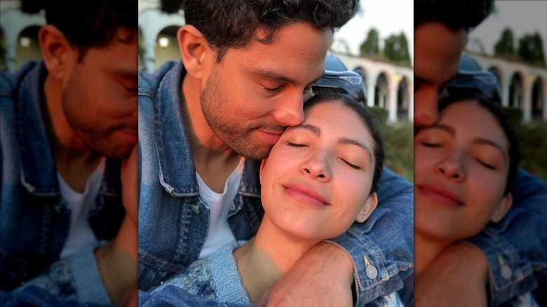 Adam Rodriguez embraces his wife Grace Gail in a photo