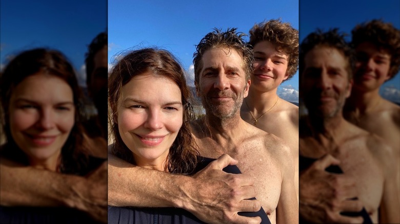 Jeanne Tripplehorn smiles for a beach photo with her husband Leland Orser and son August