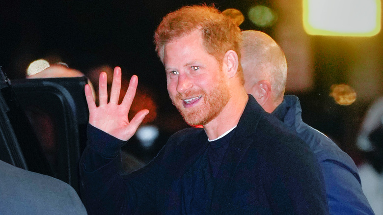 Prince Harry smiling and waving