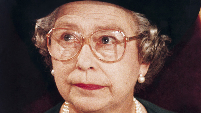 Queen Elizabeth II glasses pearl earrings
