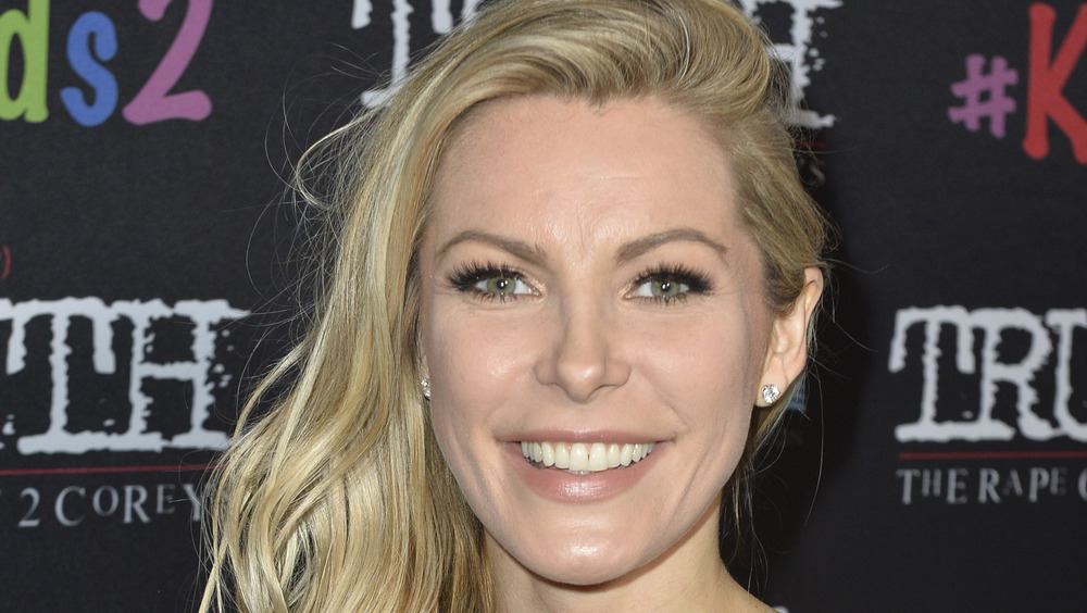 Crystal Hefner smiles at event