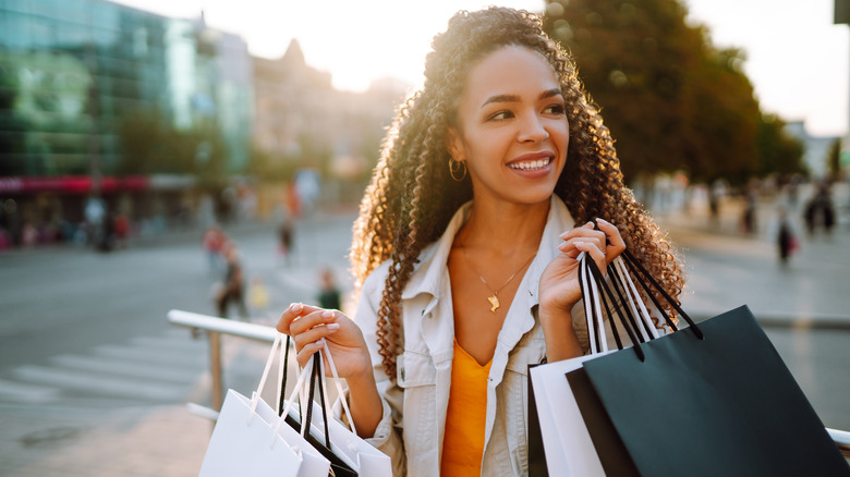 A woman holding shopping bags