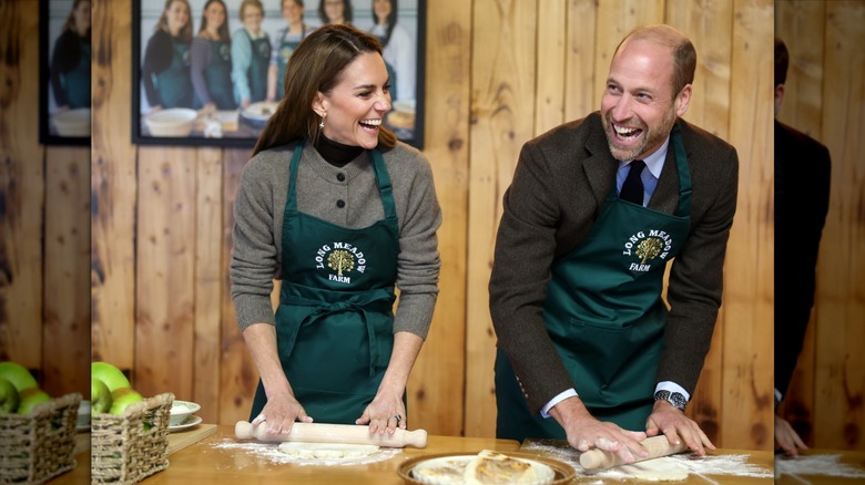 Kate Middleton and Prince William laughing with rolling pins