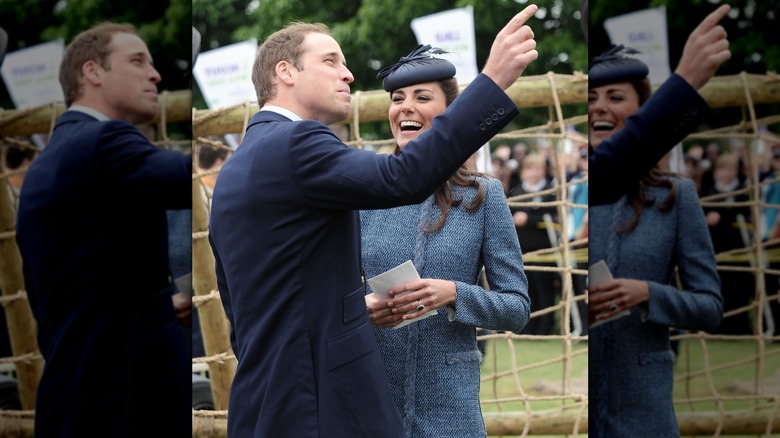 Prince William pointing as Kate Middleton laughs