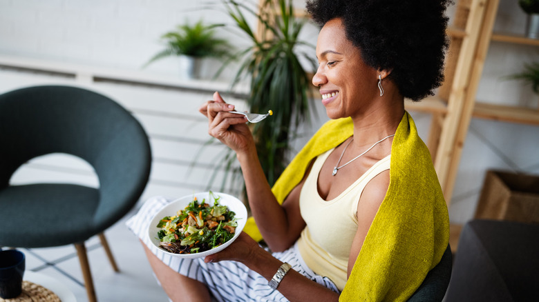 Woman eating salad