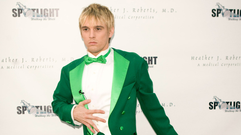 Aaron Carter in green tuxedo attending Dancing With the Stars event
