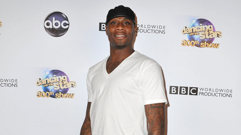 Jacoby Jones posing against a white backdrop at Dancing with the Stars event